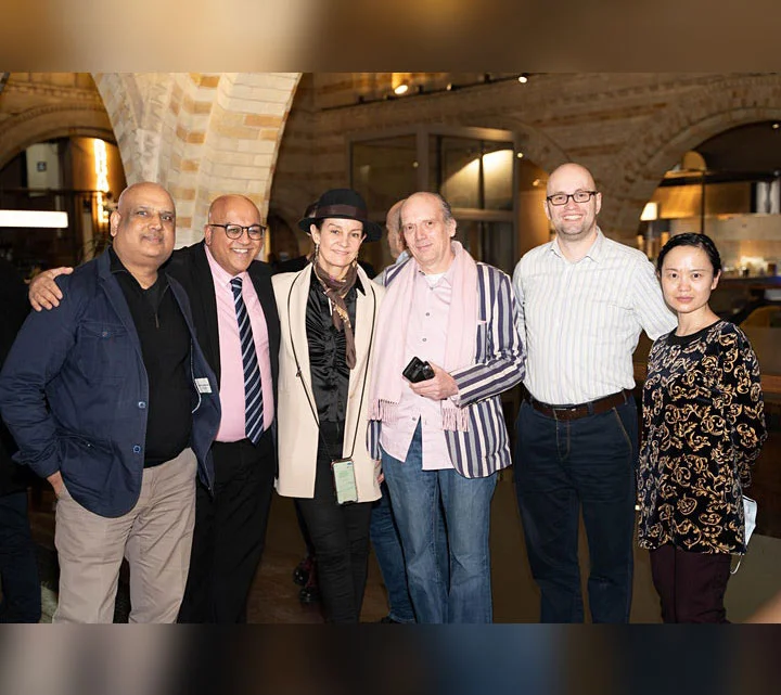 A group of people pose for a photgraph