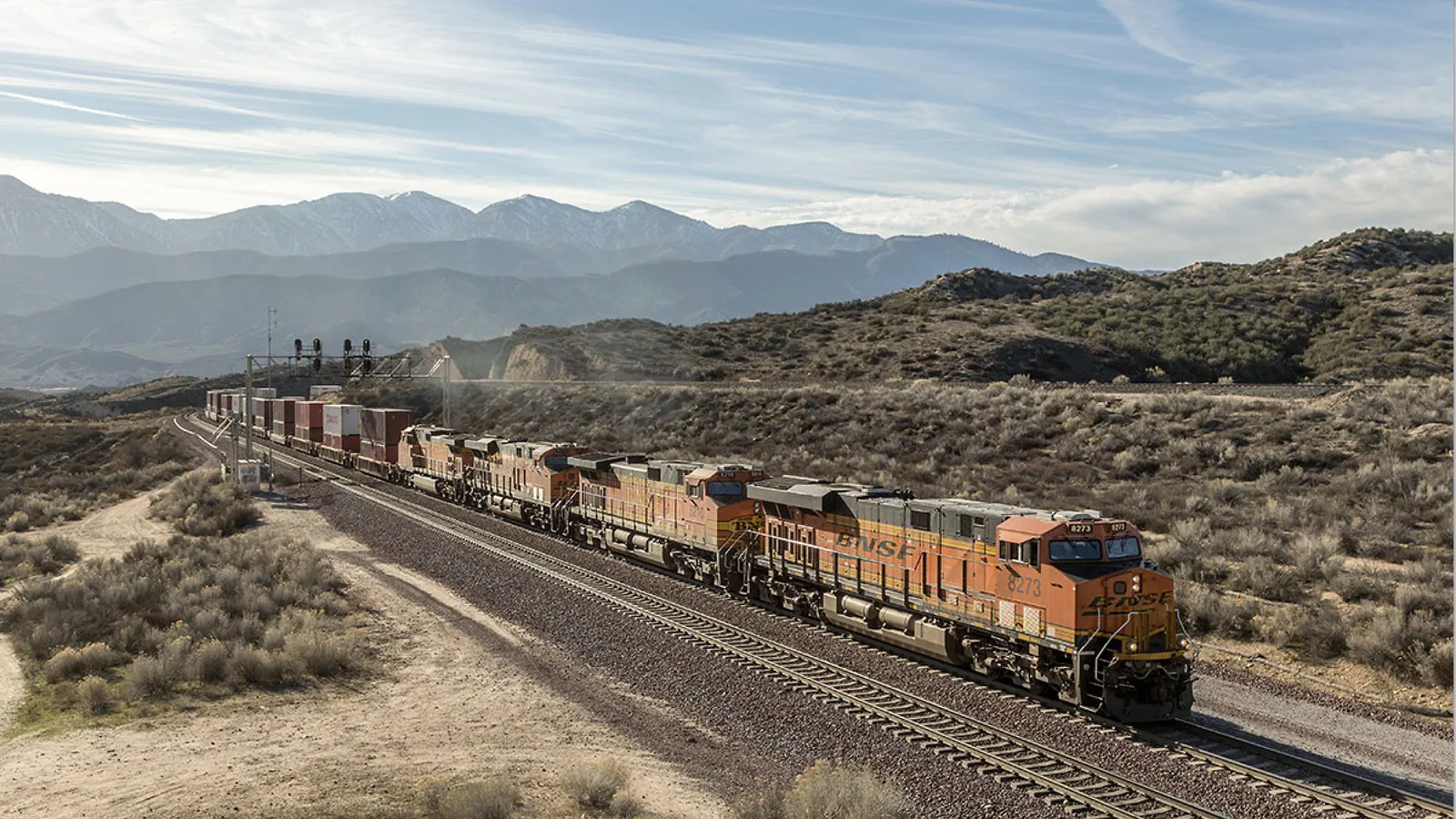 Freight trains at an intermodal logistics facility handling cargo containers